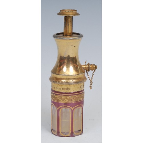 1232 - An early 20th century French gilt metal and cranberry flashed glass perfume or scent atomiser, Le Pa... 