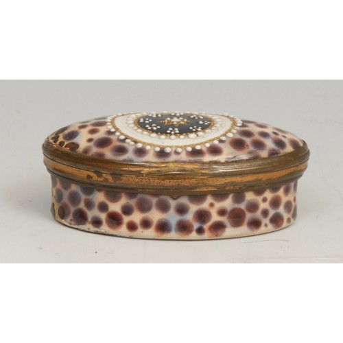 1235 - An unusual George III South Staffordshire enamel navette shaped patch box, painted as a faux cowrie ... 