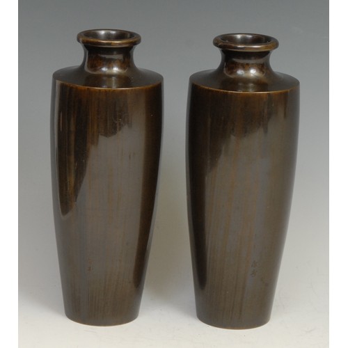 374 - A pair of Japanese bronze and ovoid vases, each inlaid in silver and mixed metals with cockerels per... 