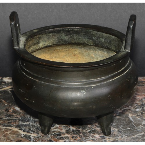 434 - A Chinese bronze tripod ding censer, angular lug handles, 12.5cm diam, six character mark