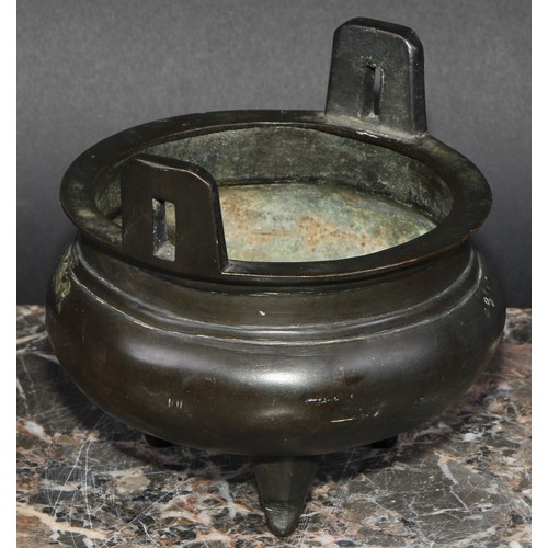 434 - A Chinese bronze tripod ding censer, angular lug handles, 12.5cm diam, six character mark