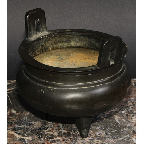 434 - A Chinese bronze tripod ding censer, angular lug handles, 12.5cm diam, six character mark