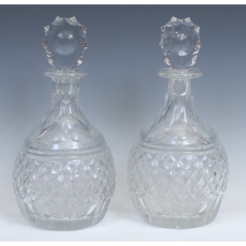 320 - A pair of large cut-glass magnum decanters, probably Irish, facetted tear shaped stoppers, star-cut ... 