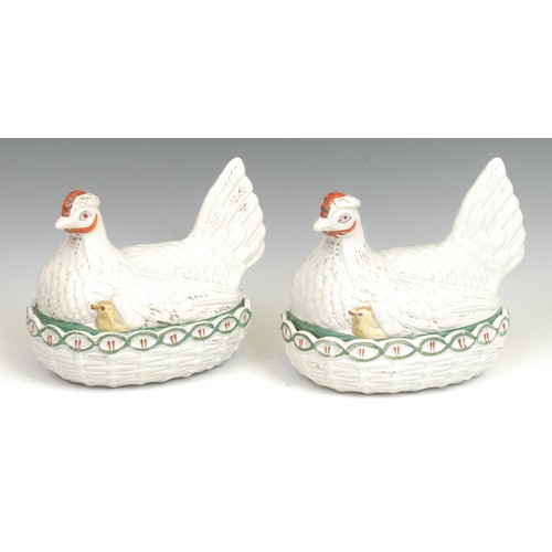 91 - A 19th century pottery novelty egg basket, as a chicken and chicks on a nest, picked out in tones of... 