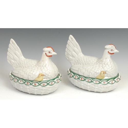 91 - A 19th century pottery novelty egg basket, as a chicken and chicks on a nest, picked out in tones of... 