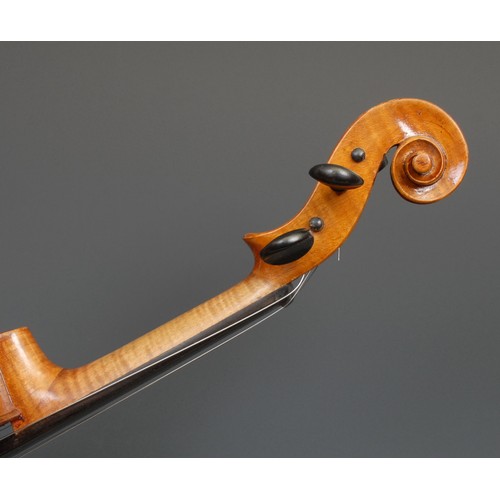 2562 - A violin, the two-piece back 35.75cm long excluding button, ebony tuning pegs, outlined throughout w... 