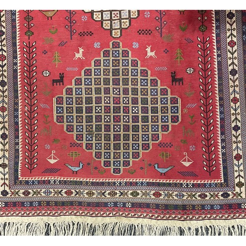 2114 - An Uzbek design Bukhara type wool rug or carpet, worked in the traditional manner, 201cm x 121cm