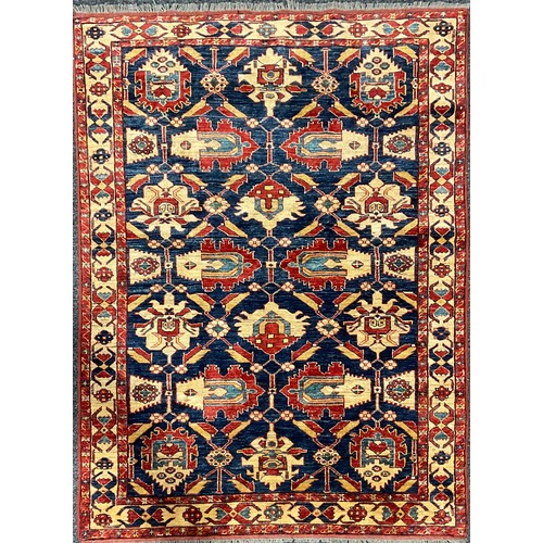 2113 - An Afghan design Shirvan type wool rug or carpet, worked in the traditional manner, 191cm x 139cm