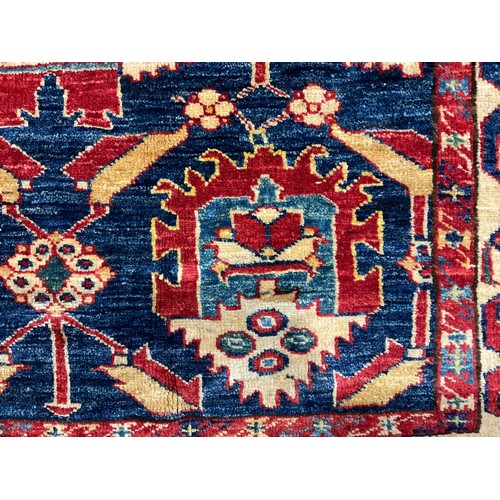 2113 - An Afghan design Shirvan type wool rug or carpet, worked in the traditional manner, 191cm x 139cm