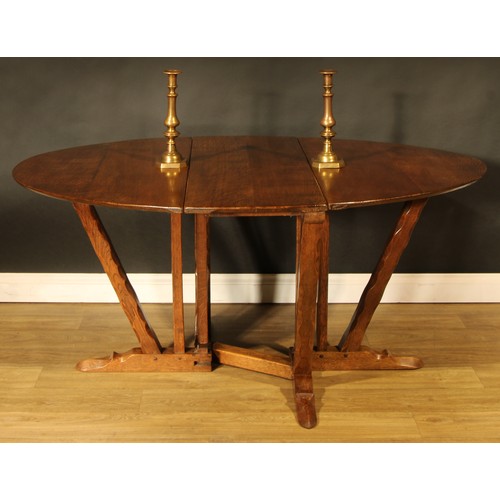 1562 - An oak gateleg dining table, by Rupert/Nigel Griffiths Monastic Woodcraft, 73cm high, 44cm opening t... 