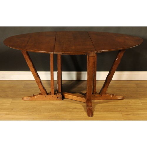 1562 - An oak gateleg dining table, by Rupert/Nigel Griffiths Monastic Woodcraft, 73cm high, 44cm opening t... 