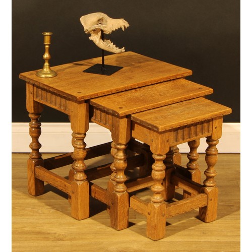 1564 - An oak nest of three occasional tables, by Rupert/Nigel Griffiths Monastic Woodcraft, the largest 45... 