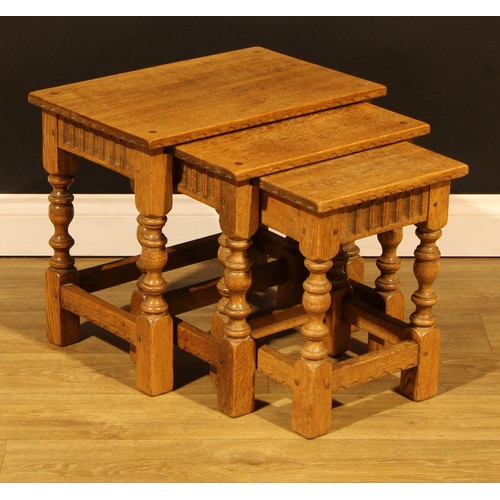 1564 - An oak nest of three occasional tables, by Rupert/Nigel Griffiths Monastic Woodcraft, the largest 45... 