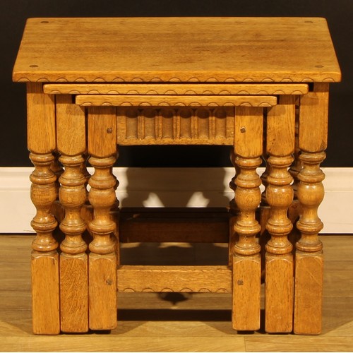 1564 - An oak nest of three occasional tables, by Rupert/Nigel Griffiths Monastic Woodcraft, the largest 45... 