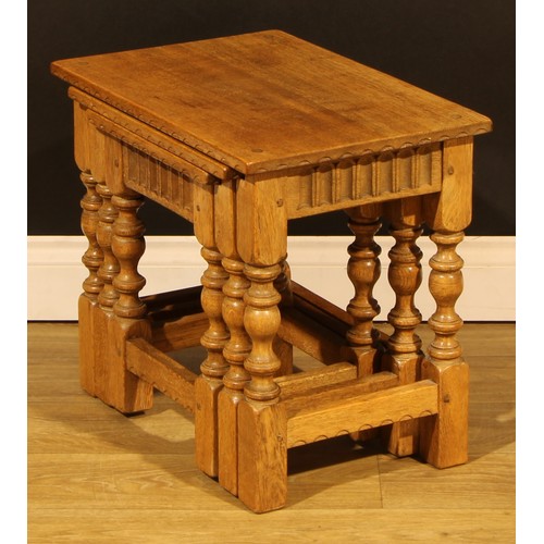 1564 - An oak nest of three occasional tables, by Rupert/Nigel Griffiths Monastic Woodcraft, the largest 45... 