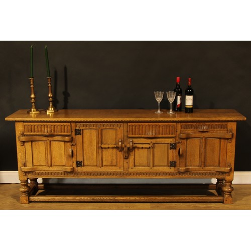 1563 - An oak low dresser or sideboard, by Rupert/Nigel Griffiths Monastic Woodcraft, 76cm high, 198.5cm wi... 