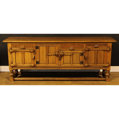 1563 - An oak low dresser or sideboard, by Rupert/Nigel Griffiths Monastic Woodcraft, 76cm high, 198.5cm wi... 