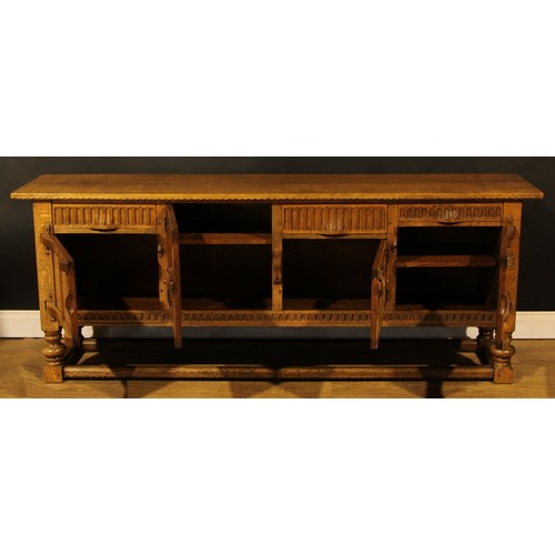 1563 - An oak low dresser or sideboard, by Rupert/Nigel Griffiths Monastic Woodcraft, 76cm high, 198.5cm wi... 