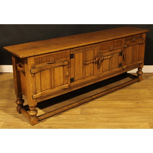 1563 - An oak low dresser or sideboard, by Rupert/Nigel Griffiths Monastic Woodcraft, 76cm high, 198.5cm wi... 