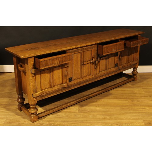 1563 - An oak low dresser or sideboard, by Rupert/Nigel Griffiths Monastic Woodcraft, 76cm high, 198.5cm wi... 