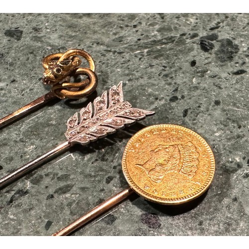 917 - A USA Indian princess gold One Dollar stick pin, the coin dated 1857; a gold coloured metal snake he... 