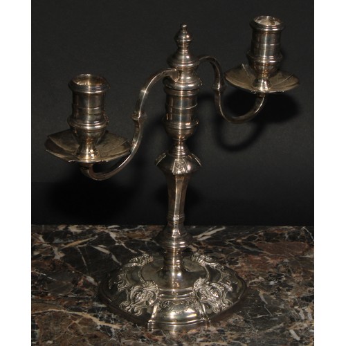 671 - A pair of George III style silver two branch candelabra, Nayler Brothers, London 1959, 1,165g (2)