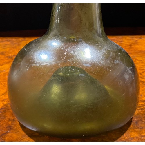 2208 - An early 18th century olive glass onion bottle, trailed rim, kick up base with pontil scar, 20cm hig... 