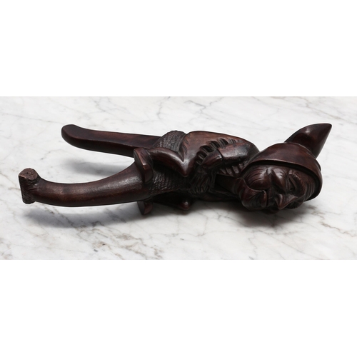 2231 - Nutcrackers - a Black Forest novelty lever-action nut cracker, carved as a gnome, 27cm long, early 2... 