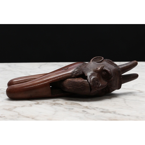 2265 - Nutcrackers - a Black Forest novelty lever-action nut cracker, carved as bearded man with devil or c... 