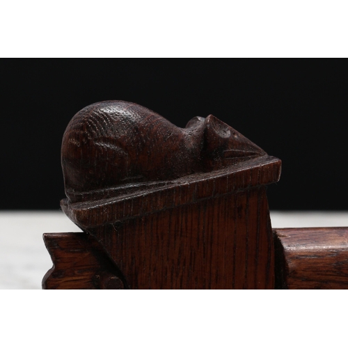 2328 - Nutcrackers - an oak lever-action nut cracker, carved with a mouse in the manner of Robert Thompson,... 