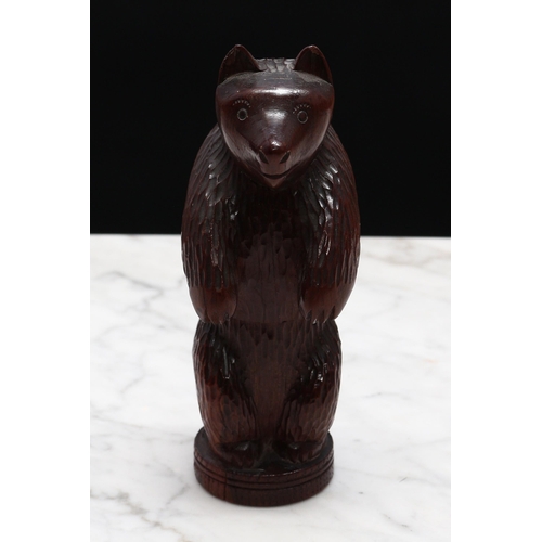 2288 - Nutcrackers - a Black Forest novelty table top screw-action nut cracker, carved as a bear, standing,... 