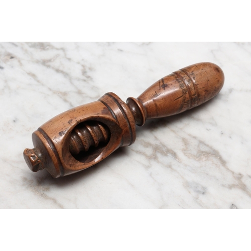 2242 - Nutcrackers - a 19th century boxwood screw-action nut cracker, turned handle, 12cm long, c.1840