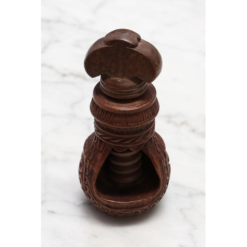 2256 - Nutcrackers - a 19th century Swiss acorn shaped screw-action nut cracker, carved with a band of lotu... 