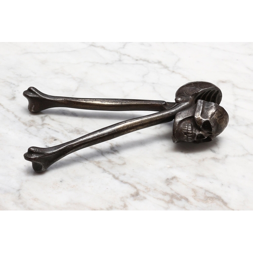 2326 - Nutcrackers - an early 20th century lever-action novelty memento mori nut cracker, cast as a skull a... 