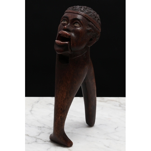 2277 - Nutcrackers - a Black Forest novelty lever-action nut cracker, carved as the head of an African-Amer... 