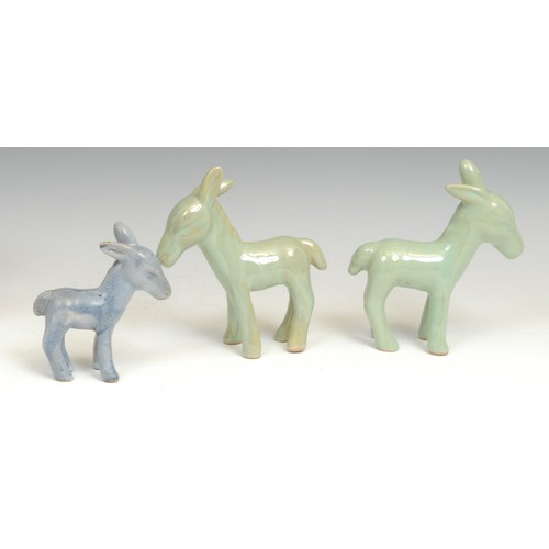 164 - A pair of Denby stoneware donkey models, glazed throughout in pale gloss green, 14.5cm; another smal... 