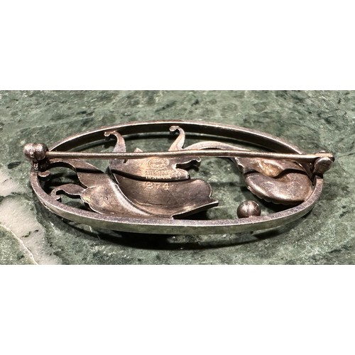 939 - Georg Jensen - a Danish silver oval brooch, decorated with styalised flowerheads in an open mount, d... 