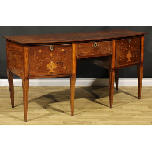 1241 - A 19th century mahogany and marquetry bow-centre sideboard or serving table, oversailing top above t... 