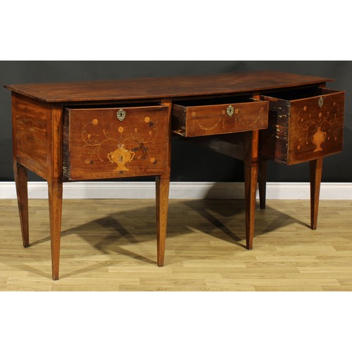 1241 - A 19th century mahogany and marquetry bow-centre sideboard or serving table, oversailing top above t... 