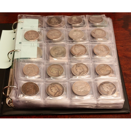 2595 - A collection of UK mainly silver coins – green ring binder album in slip case containing a selection... 