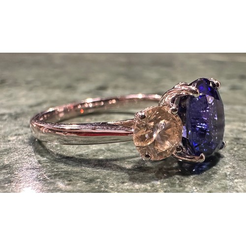 874 - A diamond and synthetic sapphire ring, central vibrant blue certified synthetic sapphire 2.87ct, mou... 