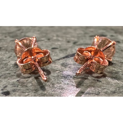 905 - A pair of diamond stud earrings, set with two round brilliant cut certified diamonds, colour O-P, cl... 