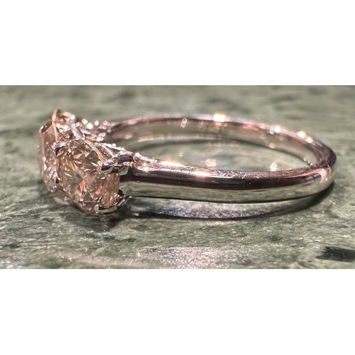 882 - A diamond ring, linear set with three certified round brilliant cut diamonds, total diamond weight, ... 