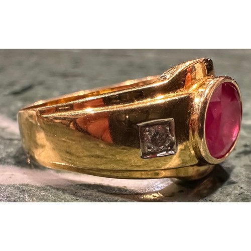 909 - A ruby and diamond ring, central oval rub over set ruby approx 2.80ct, between round brilliant cut d... 