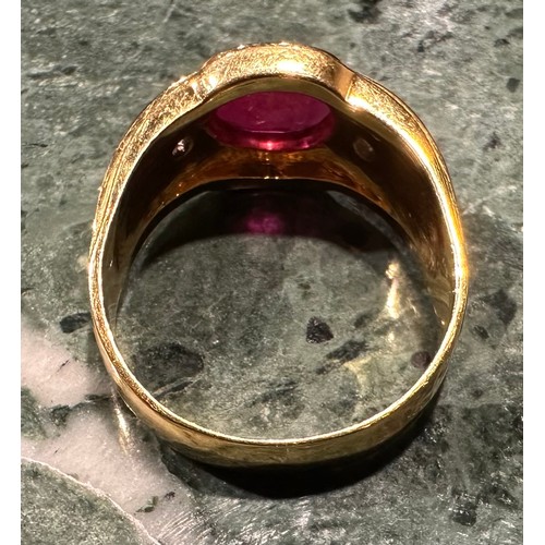 909 - A ruby and diamond ring, central oval rub over set ruby approx 2.80ct, between round brilliant cut d... 