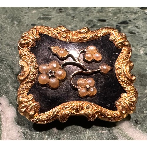 920 - A Victorian navette shaped mourning brooch, the central oval locket with a fleur de lis of hair with... 