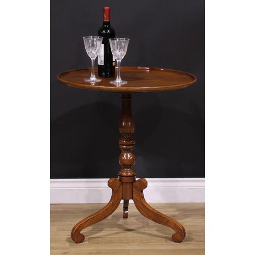 1255 - A 19th century mahogany tripod occasional table, one-piece dished circular top, turned column, scrol... 