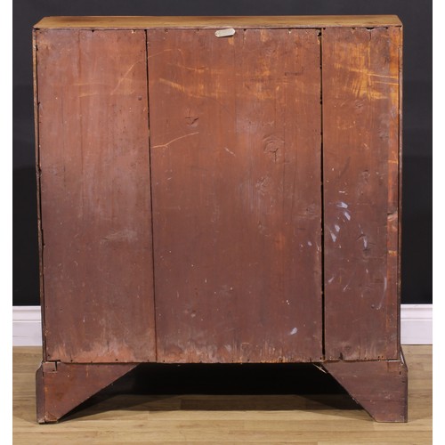 1301 - A George III mahogany bureau, fall front enclosing small drawers and pigeonholes, above four long gr... 