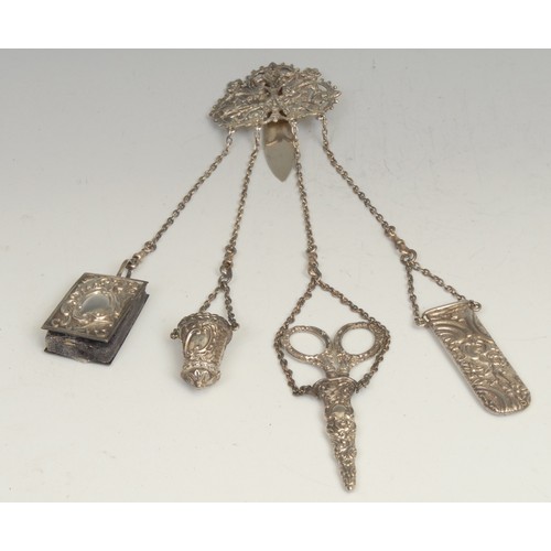 1219 - An early 20th century silver chatelaine, the clip pierced and embossed with Indian deities, Chester ... 