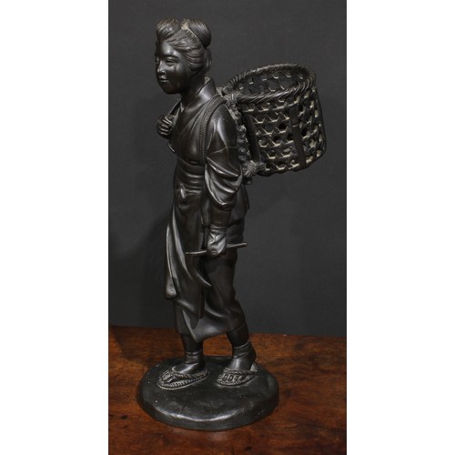 467 - Japanese School (Meiji period), a dark patinated bronze, of a young girl returning from the fields, ... 